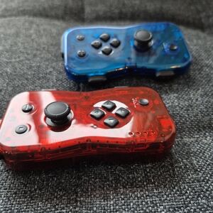 Transparent Red and Blue Gaming Controllers